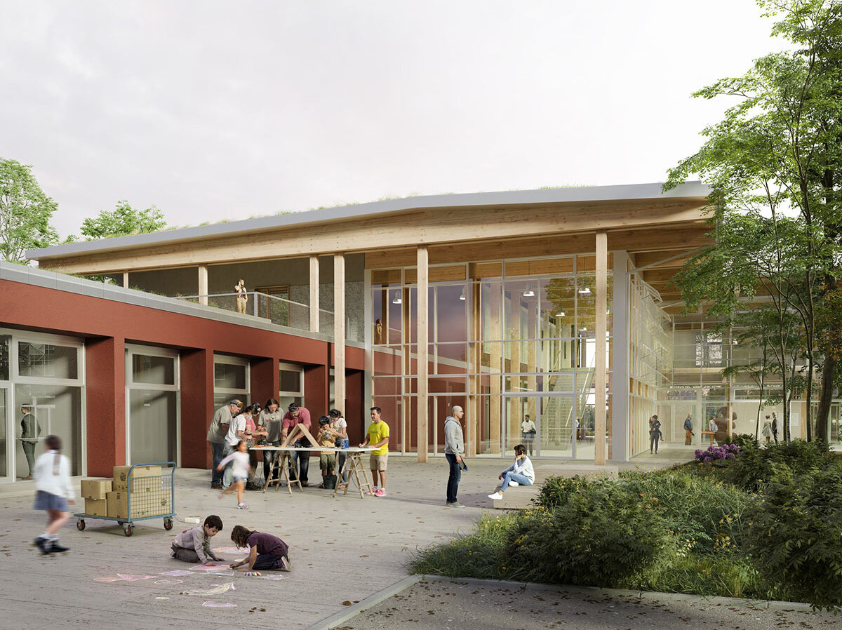 modernes Gebäude mit viel Glas, im Vordergrund spielen Kinder auf dem Fußweg