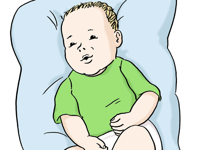 Baby liegt auf einem Kissen